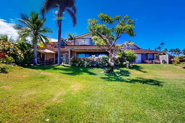 Enjoy expansive tropical lawns surrounding this beautiful island home.