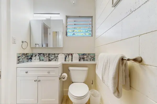 The full bathroom features modern finishes and everything you need for a comfortable stay.
