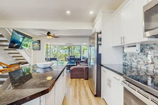 The open kitchen flows seamlessly into the living area for effortless entertaining.