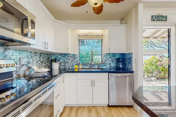 Cook with ease in the bright, fully equipped kitchen featuring modern finishes.