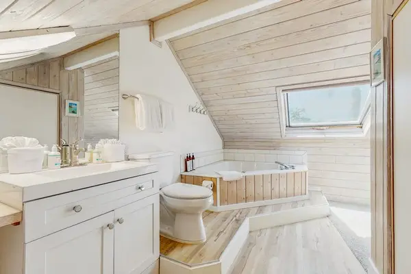 Relax in the spa-inspired bathroom featuring a soothing soaking tub.