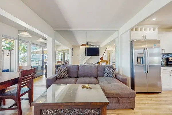 Relax in the bright open-concept living room with seamless indoor-outdoor living.