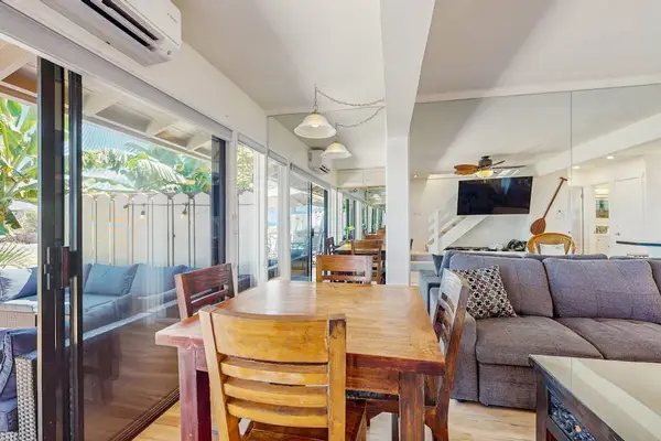 The dining area offers the perfect setting for family meals and conversation.
