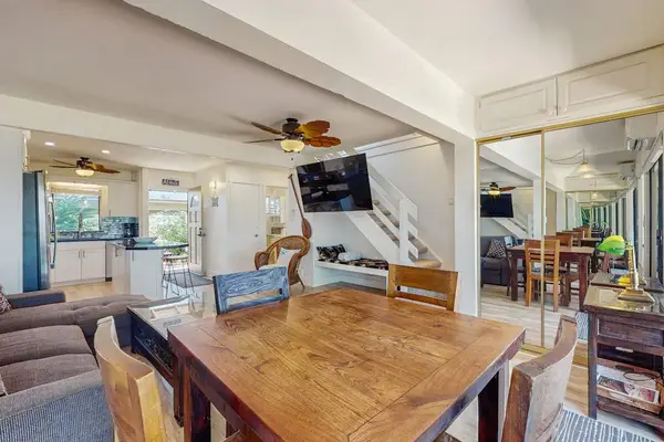 Gather around the dining table for memorable meals in a welcoming open layout.