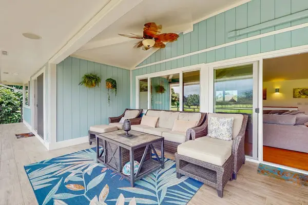An inviting, coastal-style lanai for outdoor lounging and relaxation