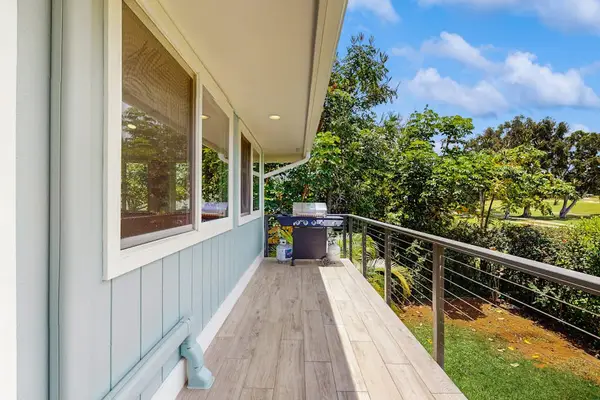 An outdoor Balcony with a grill extends alongside the house
