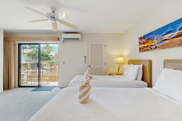 Comfortable twin beds create a welcoming sleep space for relaxing resort stays