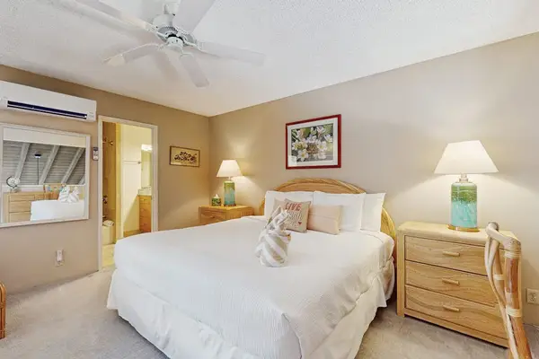 Offers restful bedding beneath white ceilings and daylight