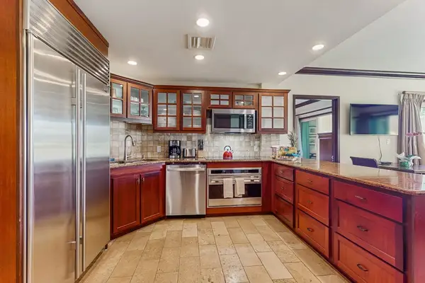 Prepare and enjoy delicious meals in the modern kitchen featuring sleek stainless steel appliances.
