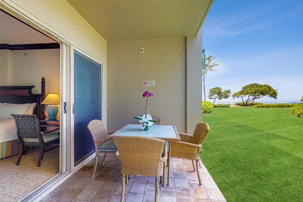 Private patio just outside the primary bedroom with seating for four—perfect for morning coffee or evening relaxation.