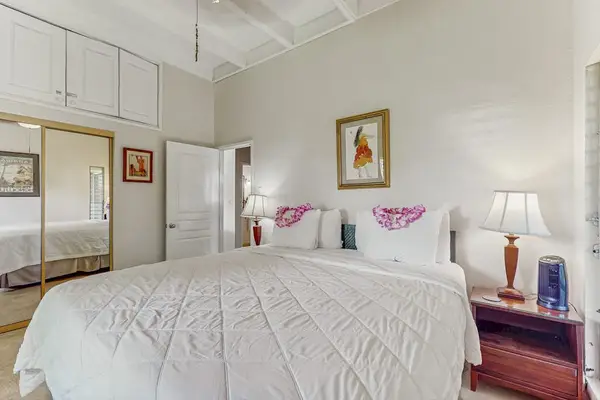 Bright & Restful Guest Bedroom with Comfortable Bed & Mirror Closets