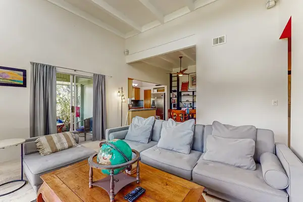 Spacious Living Room with Plush Modular Sofa & Lanai Access