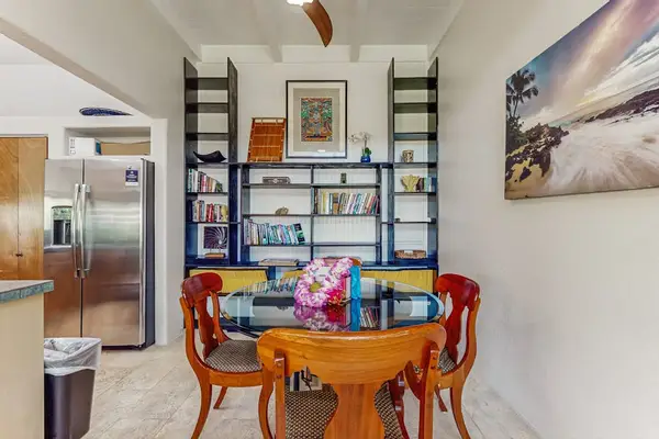 Cozy Dining Nook with Built-in Library & Open Kitchen Access