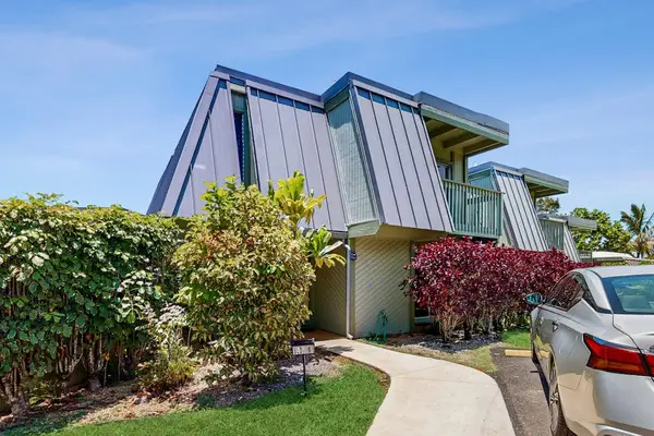 Private Building Entrance with Tropical Landscaping & Dedicated Parking