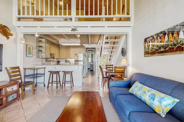 Open Living Room With Island Charm