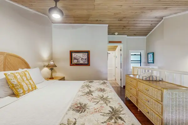 Warm Coastal Bedroom With Charming Wicker Accents