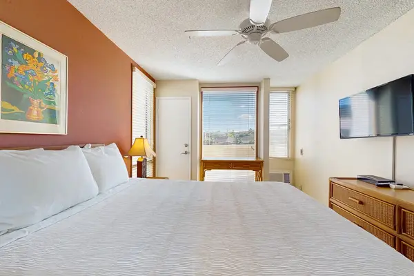 Bright Guest Bedroom With Smart TV