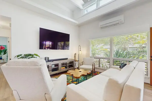 Open living area welcomes evenings with generous seating and artwork