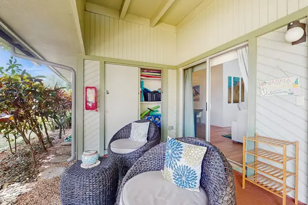 Covered patio offers comfortable seating for outdoor gatherings and dining