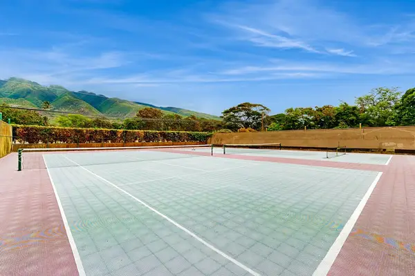Outdoor court provides a spacious recreational area beneath blue skies