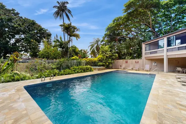 Sunlit pool creates an inviting setting for daytime outdoor relaxation