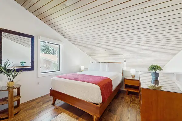 Cozy loft bedroom with natural light