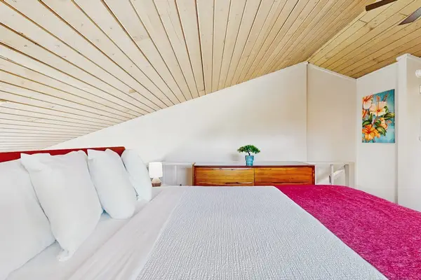 Comfortable loft bedroom with island charm