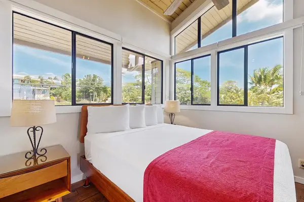 Comfortable primary bedroom filled with natural light