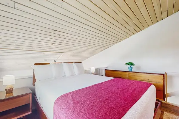 Bright loft bedroom with vaulted ceilings