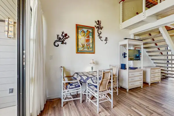 Dining room with seating for three for those quiet nights in while you take in the views from the lanai.
