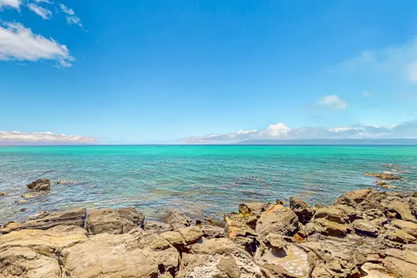 Crystal Clear Ocean Over Lava Rocks