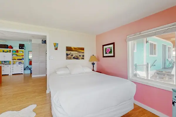 Spacious living room with a comfortable bed