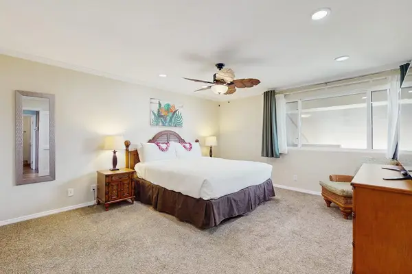 Large master bedroom with king bed, flat screen tv and en-suite bathroom.