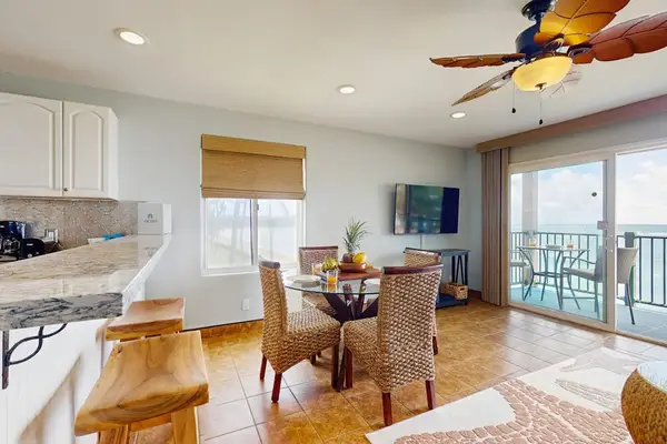 Barstools at the kitchen counter for extra seating.