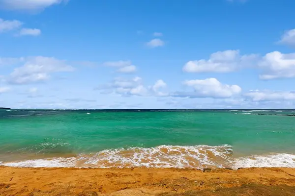 Gaze out over the crashing waves on to the white sandy beaches.