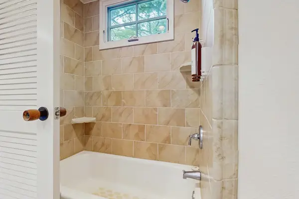 Bright bathroom welcomes you with a clean spacious layout and refreshing everyday comfort
