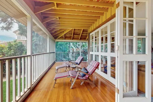 Spacious covered balcony creates the perfect outdoor space for peaceful mornings and evenings