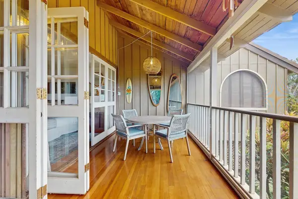 Balcony dining area combines fresh island air with comfortable outdoor mealtime experiences together
