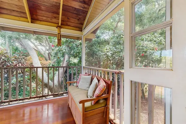 Relax beneath the covered balcony in a peaceful space designed for everyday comfort