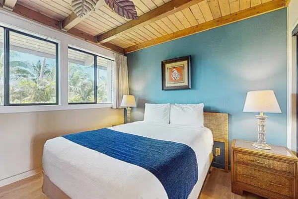Spacious queen bedroom with lots of natural light.