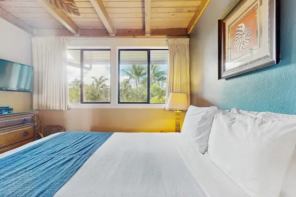Master bedroom with queen bed and flat screen tv.