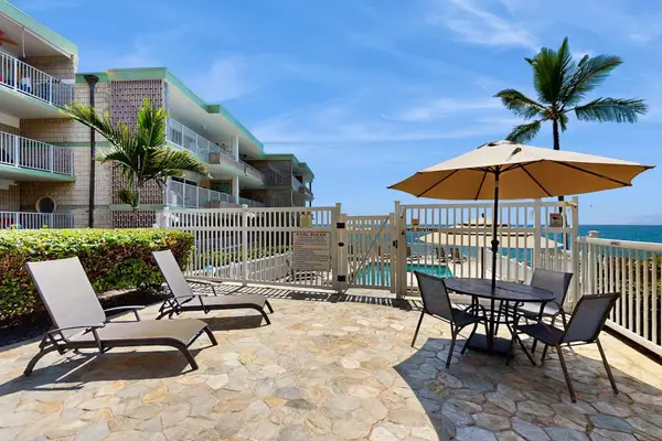Oceanfront Patio Deck with Sun Loungers & Outdoor Dining Setup