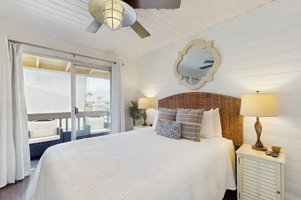 Cozy Bedroom with Woven Headboard, Ceiling Fan & Lanai Access
