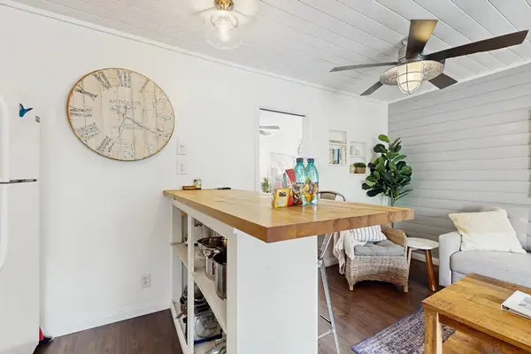 Kitchen Breakfast Bar Island with Stools Connected to Living Space