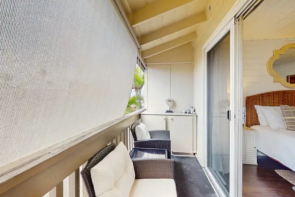 Private Covered Balcony with Comfortable Seating & Privacy Screen