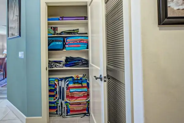 Storage Closet Stocked with Beach Chairs & Linens