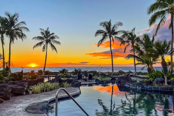 Oceanfront Resort Pool & Lava Rock Features at Sunset