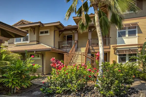 Front Exterior Entryway surrounded by Tropical Flowers & Palms