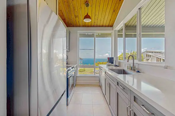 Newly remodeled kitchen with stainless steel appliances.