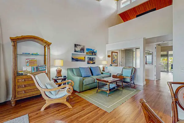 Living room with vaulted ceilings.